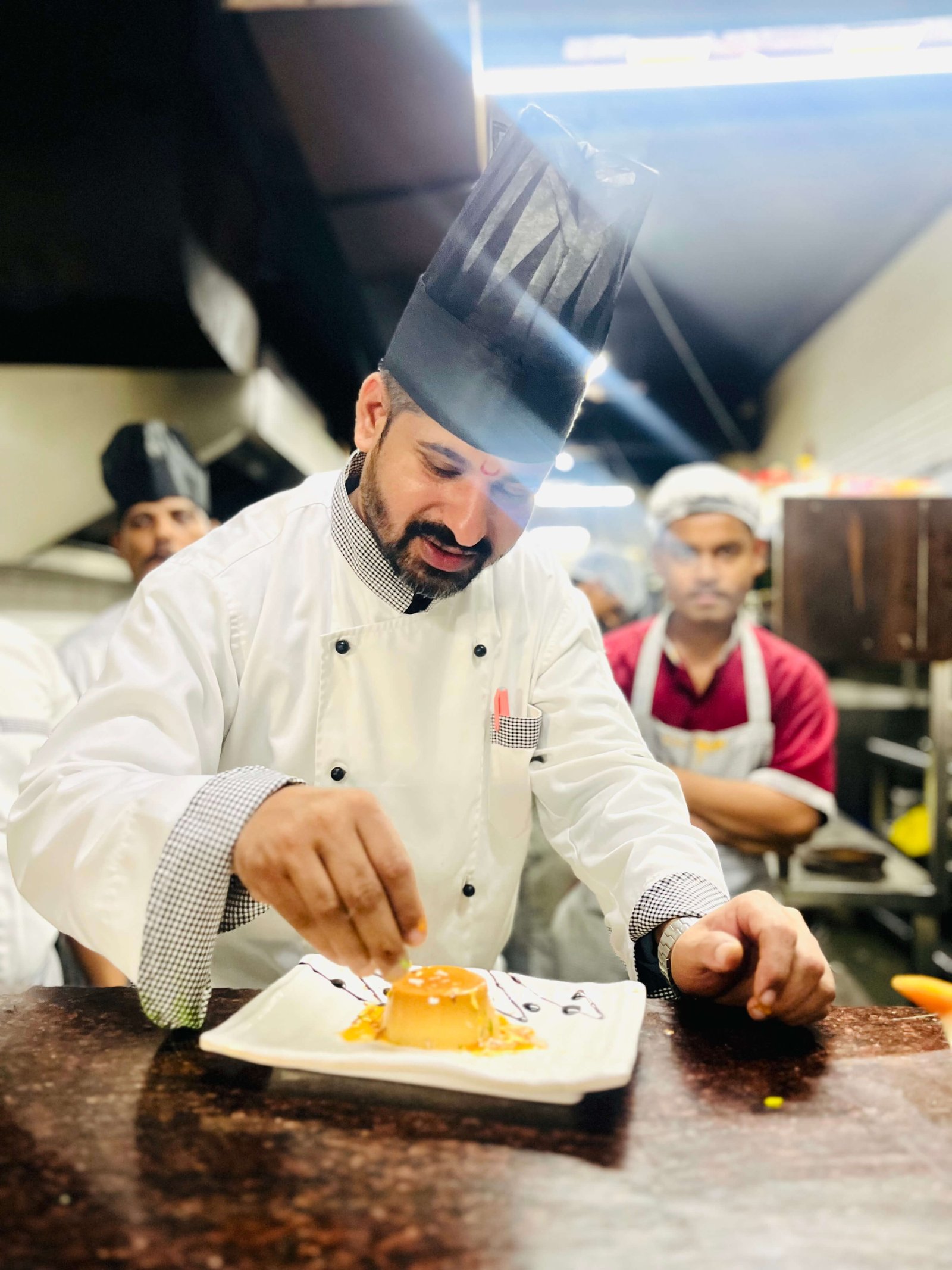 Chef garnishing food